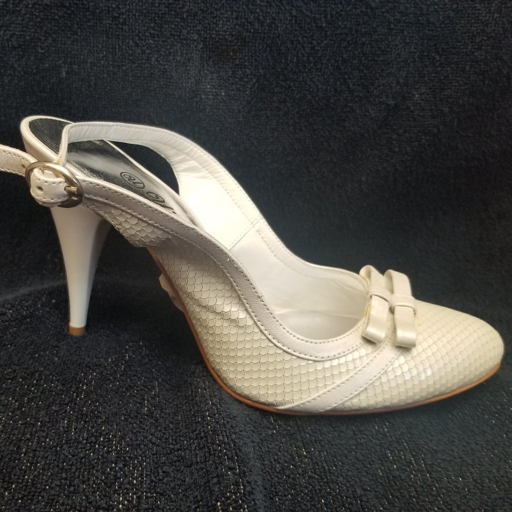 Low heel white leather pumps. New and Unworn.